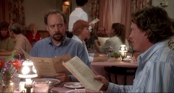 Movie still from “Sideways” (2004), directed by Alexander Payne – Two people sitting at a table in front of a menu; Close Up shot, Over the shoulder angle