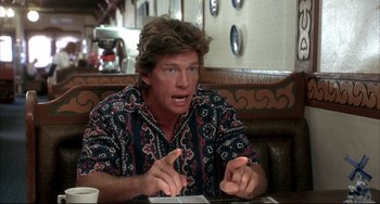 Movie still from “Sideways” (2004), directed by Alexander Payne – A man sitting at a table in front of a cup of coffee; Medium shot, Over the shoulder angle