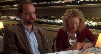 Movie still from “Sideways” (2004), directed by Alexander Payne – A man and a woman sitting at a table with a glass of white wine; Medium shot, Over the shoulder angle