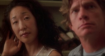 Movie still from “Sideways” (2004), directed by Alexander Payne – A woman and a man sitting next to each other in a room; Close Up shot, Over the shoulder angle
