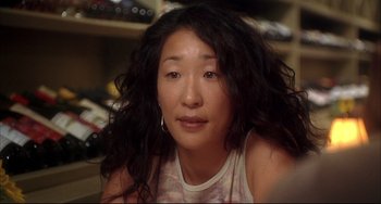 Movie still from “Sideways” (2004), directed by Alexander Payne – A person with long black curly hair; Close Up shot, Over the shoulder angle