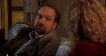 Movie still from “Sideways” (2004), directed by Alexander Payne – A man sitting on a couch looking at a woman; Close Up shot, Over the shoulder angle