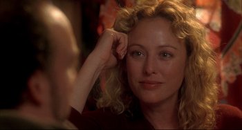 Movie still from “Sideways” (2004), directed by Alexander Payne – A person with curly blonde hair; Close Up shot, Over the shoulder angle