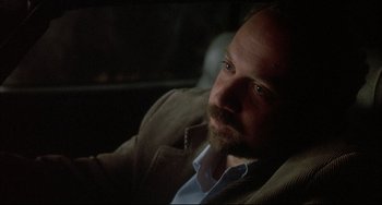 Movie still from “Sideways” (2004), directed by Alexander Payne – A man with a beard sitting in the dark; Close Up shot, Over the shoulder angle