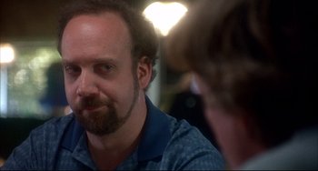 Movie still from “Sideways” (2004), directed by Alexander Payne – A man with a goatee is looking at himself in the mirror; Close Up shot, Over the shoulder angle