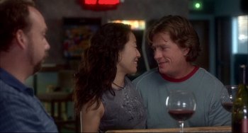 Movie still from “Sideways” (2004), directed by Alexander Payne – A man and a woman sitting next to each other at a bar; Medium shot, Over the shoulder angle