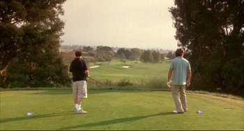 Movie still from “Sideways” (2004), directed by Alexander Payne – Two men standing on a golf course holding golf clubs; Extreme Wide shot, High angle