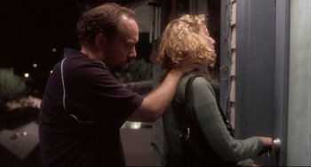 Movie still from “Sideways” (2004), directed by Alexander Payne – A man and a woman standing next to each other on the street; Medium shot, Over the shoulder angle