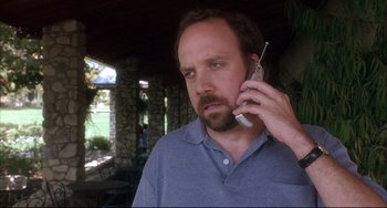 Movie still from “Sideways” (2004), directed by Alexander Payne – A man holding a cell phone up to his ear; Close Up shot, Low angle