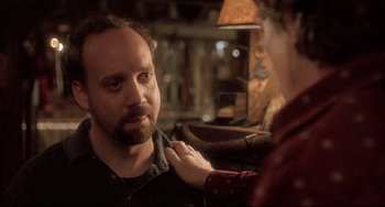 Movie still from “Sideways” (2004), directed by Alexander Payne – A man with a goatee is talking to a woman; Close Up shot, Over the shoulder angle