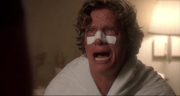 Movie still from “Sideways” (2004), directed by Alexander Payne – A person with a bandage on his face; Close Up shot, Low angle