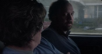 Movie still from “Sideways” (2004), directed by Alexander Payne – A man sitting next to another man in a car; Close Up shot, Over the shoulder angle