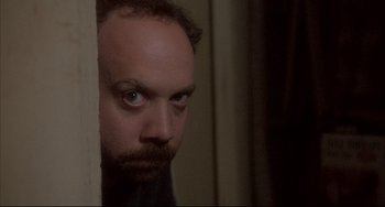 Movie still from “Sideways” (2004), directed by Alexander Payne – A person looking at the camera; Close Up shot, High angle