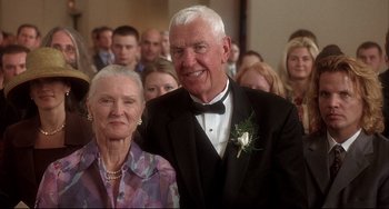 Movie still from “Sideways” (2004), directed by Alexander Payne – An older man in a tuxedo and a woman in a purple dress; Close Up shot, Low angle