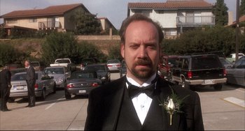 Movie still from “Sideways” (2004), directed by Alexander Payne – A man in a tuxedo standing in a parking lot; Close Up shot, Low angle