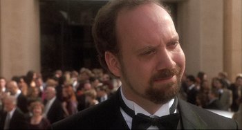 Movie still from “Sideways” (2004), directed by Alexander Payne – A person wearing a suit and bow tie; Close Up shot, Over the shoulder angle