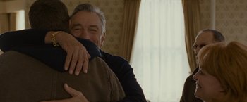 Movie still from “Silver Linings Playbook” (2012), directed by David O. Russell – An older man is hugging a pillow in a room; Close Up shot, Over the shoulder angle