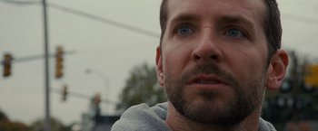 Movie still from “Silver Linings Playbook” (2012), directed by David O. Russell – A man's face with blue eyes; Close Up shot, Over the shoulder angle