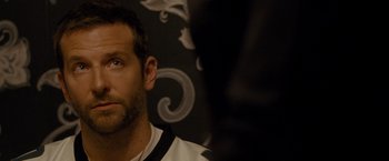 Movie still from “Silver Linings Playbook” (2012), directed by David O. Russell – A man's face in front of a wall; Close Up shot, Over the shoulder angle