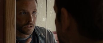 Movie still from “Silver Linings Playbook” (2012), directed by David O. Russell – A person looking at a mirror; Close Up shot, Over the shoulder angle