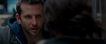 Movie still from “Silver Linings Playbook” (2012), directed by David O. Russell – A man's face as he stares at the camera; Close Up shot, Over the shoulder angle