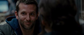 Movie still from “Silver Linings Playbook” (2012), directed by David O. Russell – A man's face as he looks into the camera; Close Up shot, Over the shoulder angle