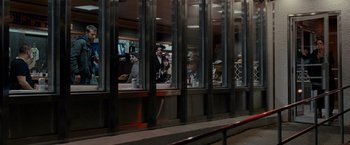 Movie still from “Silver Linings Playbook” (2012), directed by David O. Russell – A group of people sitting at a table in front of a window; Wide shot, Over the shoulder angle