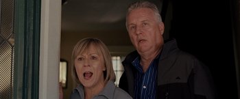 Movie still from “Silver Linings Playbook” (2012), directed by David O. Russell – An older man and a younger woman standing next to each other; Close Up shot, Low angle