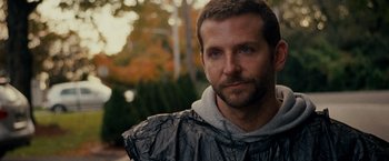 Movie still from “Silver Linings Playbook” (2012), directed by David O. Russell – A person wearing a raincoat; Close Up shot, Over the shoulder angle