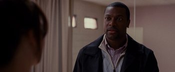 Movie still from “Silver Linings Playbook” (2012), directed by David O. Russell – A person standing in a room; Close Up shot, Over the shoulder angle