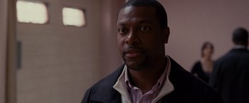 Movie still from “Silver Linings Playbook” (2012), directed by David O. Russell – A person wearing a shirt and jacket; Close Up shot, Over the shoulder angle