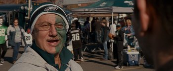 Movie still from “Silver Linings Playbook” (2012), directed by David O. Russell – An older man with green paint on his face; Close Up shot, High angle