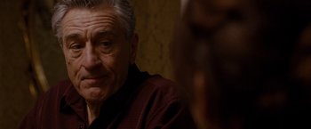 Movie still from “Silver Linings Playbook” (2012), directed by David O. Russell – An older man sitting in front of a mirror; Close Up shot, Over the shoulder angle