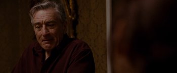 Movie still from “Silver Linings Playbook” (2012), directed by David O. Russell – An older man sitting in front of a mirror; Close Up shot, Over the shoulder angle