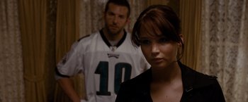Movie still from “Silver Linings Playbook” (2012), directed by David O. Russell – A man and a woman standing next to each other; Close Up shot, Over the shoulder angle
