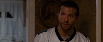 Movie still from “Silver Linings Playbook” (2012), directed by David O. Russell – A person wearing a hockey uniform; Close Up shot, Over the shoulder angle