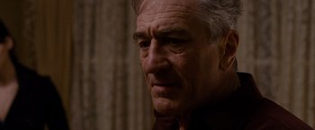 Movie still from “Silver Linings Playbook” (2012), directed by David O. Russell – An older man with white hair looking to his left; Close Up shot, Low angle