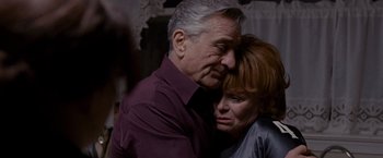 Movie still from “Silver Linings Playbook” (2012), directed by David O. Russell – An older man and a younger woman hugging; Close Up shot, Over the shoulder angle