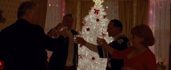 Movie still from “Silver Linings Playbook” (2012), directed by David O. Russell – Two men are toasting at a christmas party; Medium shot, Low angle