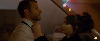 Movie still from “Silver Linings Playbook” (2012), directed by David O. Russell – A man and a woman looking at each other; Close Up shot, Over the shoulder angle