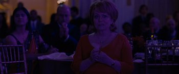 Movie still from “Silver Linings Playbook” (2012), directed by David O. Russell – A woman standing in front of a man in front of a crowd; Medium shot, Over the shoulder angle