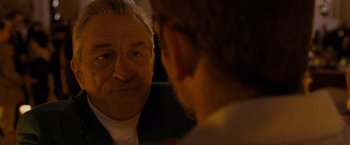 Movie still from “Silver Linings Playbook” (2012), directed by David O. Russell – An older man looking at a younger man's reflection in a mirror; Close Up shot, Over the shoulder angle