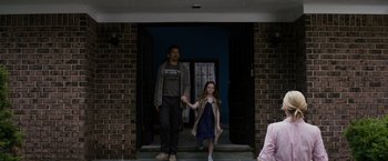 Movie still from “Sinister” (2012), directed by Scott Derrickson – A man and a little girl are holding hands; Wide shot, Over the shoulder angle