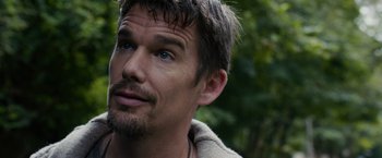 Movie still from “Sinister” (2012), directed by Scott Derrickson – A person with a beard; Close Up shot, Over the shoulder angle