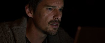 Movie still from “Sinister” (2012), directed by Scott Derrickson – A person with a beard; Close Up shot, Over the shoulder angle