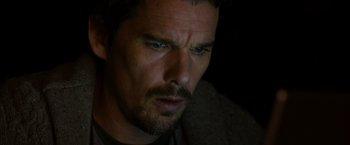 Movie still from “Sinister” (2012), directed by Scott Derrickson – A man's face in the dark; Close Up shot, High angle