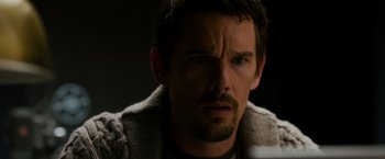 Movie still from “Sinister” (2012), directed by Scott Derrickson – A person with a beard; Close Up shot, Over the shoulder angle