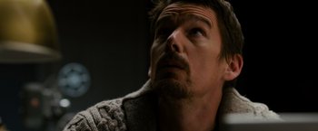 Movie still from “Sinister” (2012), directed by Scott Derrickson – A person with a beard looking up; Close Up shot, Low angle
