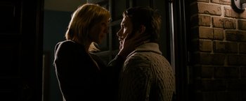Movie still from “Sinister” (2012), directed by Scott Derrickson – A man and a woman standing next to each other; Close Up shot, Low angle