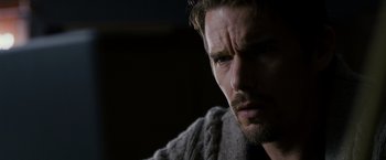 Movie still from “Sinister” (2012), directed by Scott Derrickson – A person wearing a sweater; Close Up shot, Over the shoulder angle
